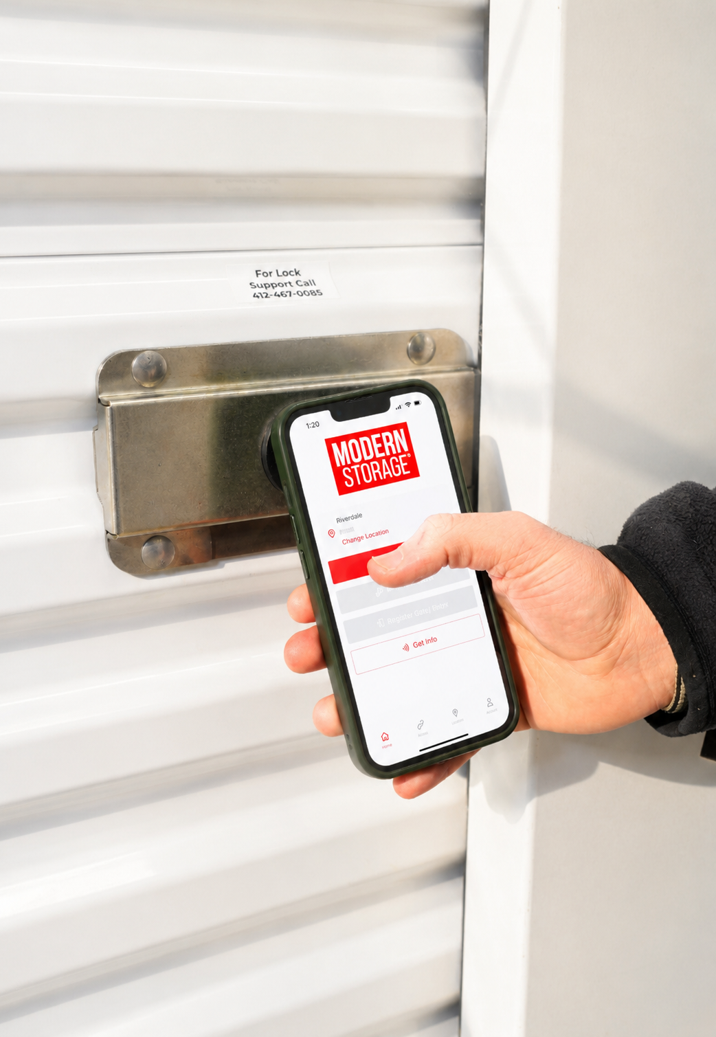 Customer using the Modern Storage® mobile app to access a smart lock on a self storage unit at the Riverdale facility.